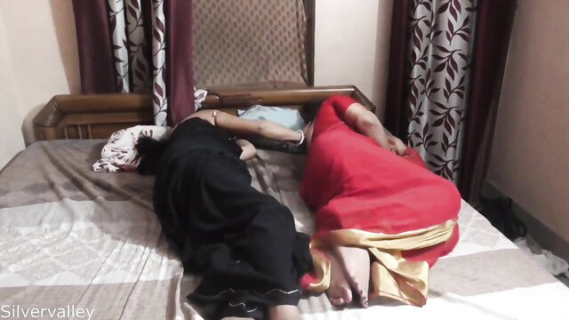 Bhabhi and busty mom in sarees lying on bed for hot Desi threesome