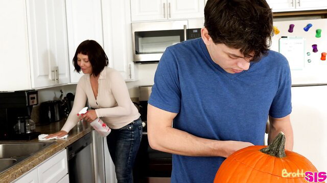 Aubrey Sinclair cleans kitchen in tight top and jeans with guy holding pumpkin