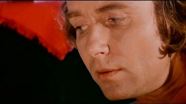 Retro 70s man with long hair in intense closeup from El Sexo que Habla