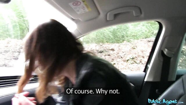 Hot brunette in leather jacket smiles in car, ready for pounding