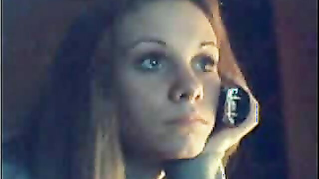 Blonde bombshell on phone call flaunting curves closeup