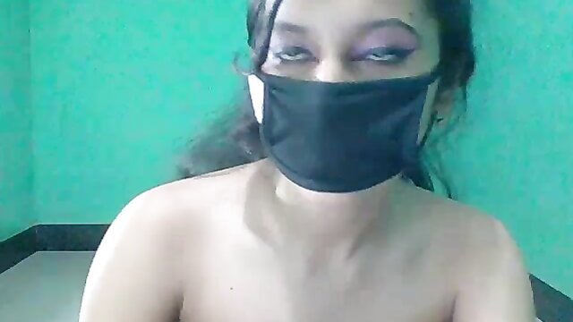 Masked slim Indian teen bares tits on webcam