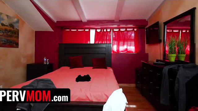 Stunning stepmom with hot body on bed in red room