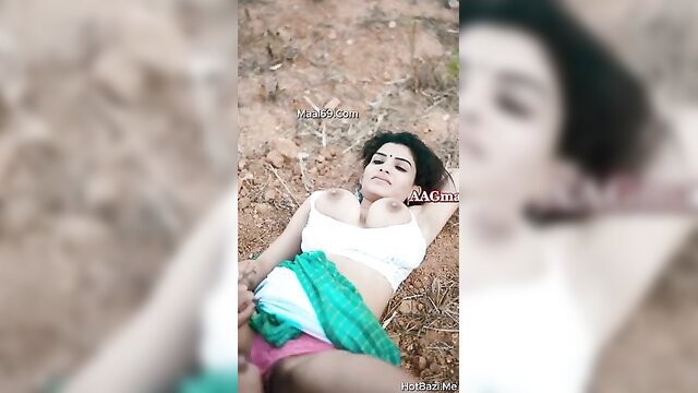 Hot Indian babe in white bra and green saree lying outdoors seductively