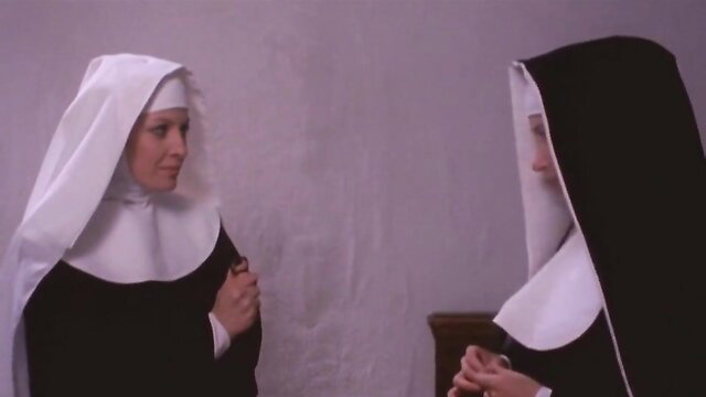 Two sexy nuns in habits whispering intimately, teasing taboo convent fantasy