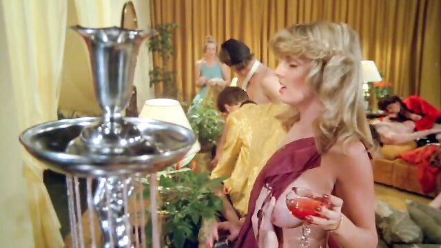 Busty blonde in sheer dress exposing big tits at Hollywood party, vintage porn