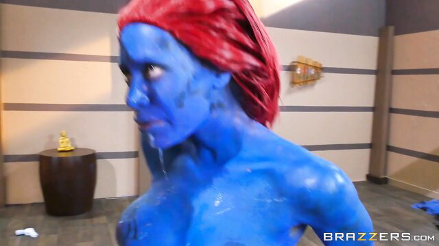 Nicole Aniston as blue-skinned Mystique with red hair dripping wet