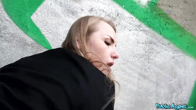 Blonde Russian Madison Lust profile view by graffiti wall in Public Agent