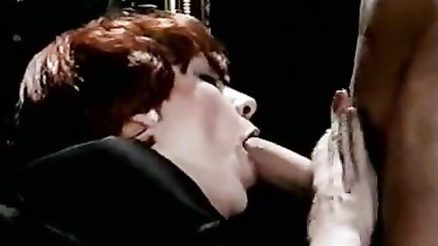 Redhead maid in black uniform sucking cock closeup in classic porn