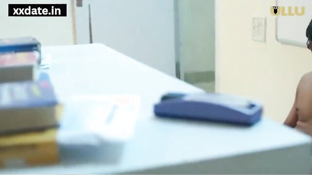 Hot Indian MILF topless with desi tits at desk in XXX scene