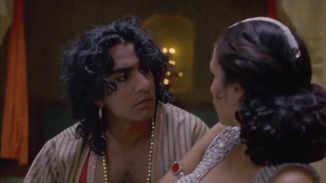 Indira Varma in seductive Arabian attire with hunk in Bollywood scene