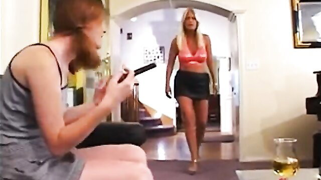 Redhead gamer dude films busty blonde MILF in mini skirt strutting over