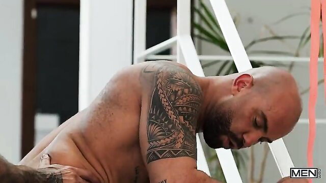Bald tattooed Papi Kocic nude with Bruno Max in gay anal scene