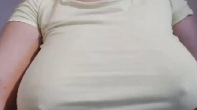 Curvy babe with massive tits in tight white top, teasing cleavage