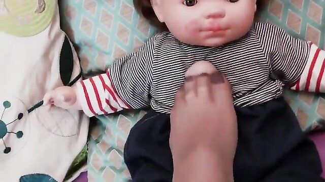 Naughty fairy tale taboo: foot on baby doll in stockings closeup