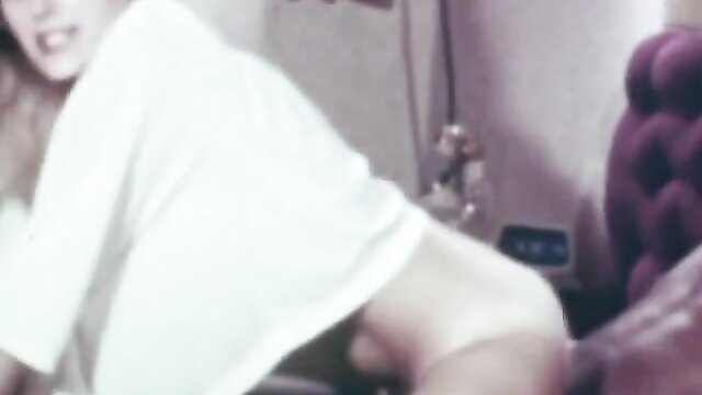 Vintage Mary in white robe teases big tits on purple chair