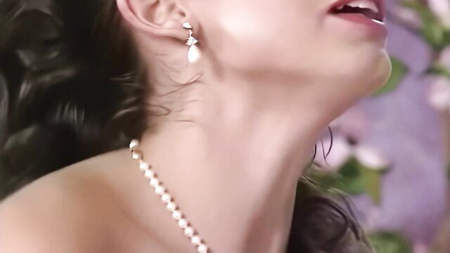 Sarah Louise Young closeup neck and pearl necklace tease