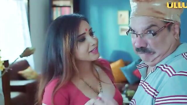 Indian bhabhi in red saree blouse flirts with older man closeup