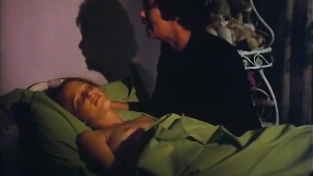 Vintage blonde woman nude in bed with man, intimate morning couple scene