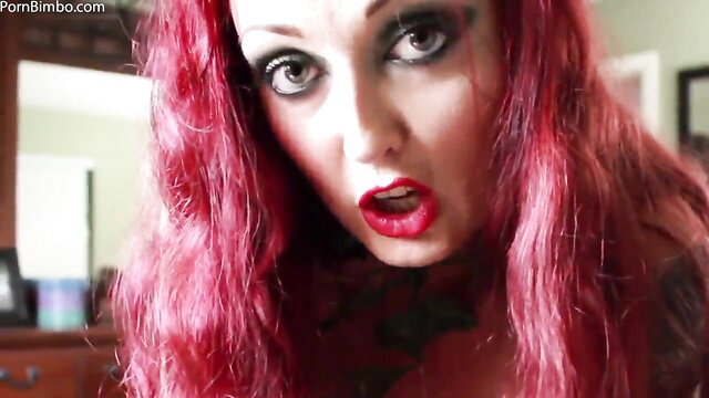 Redhead Melissa Jacobs with goth makeup in seductive cosplay closeup