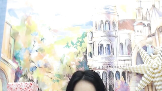 Busty Asian babe topless with natural boobs, smiling at camera