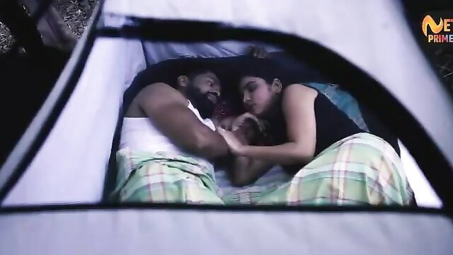 Indian college couple cuddling intimately in tent, wild jungle hookup
