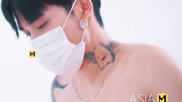 Ji Yan Xi shirtless with mask and tattoos in AsiaM trailer