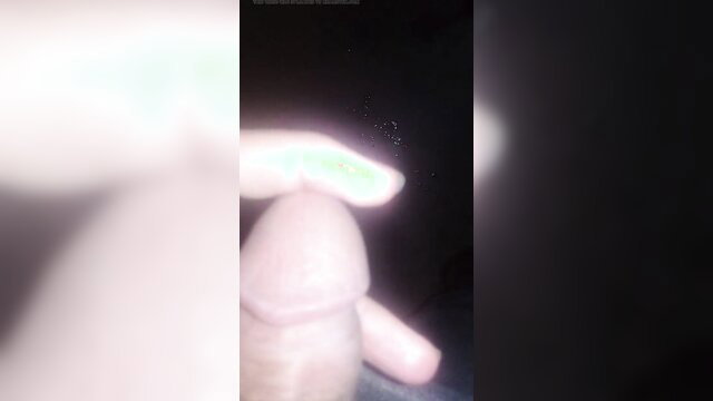Blurry closeup of big uncut cock handjob with green nail polish