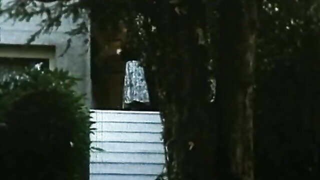 Italian maid in shiny dress on stairs, outdoor tease