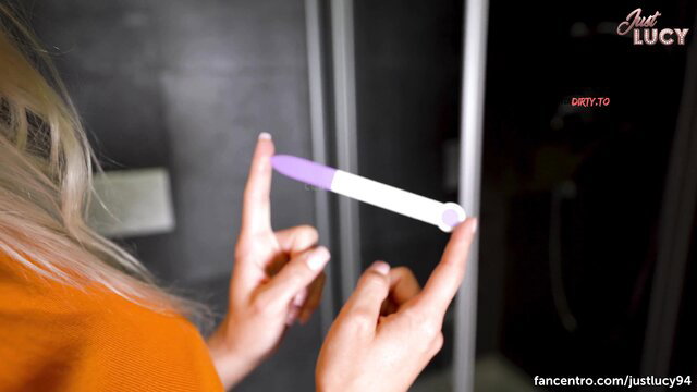 Just Lucy holds pregnancy test in kinky dirty tease