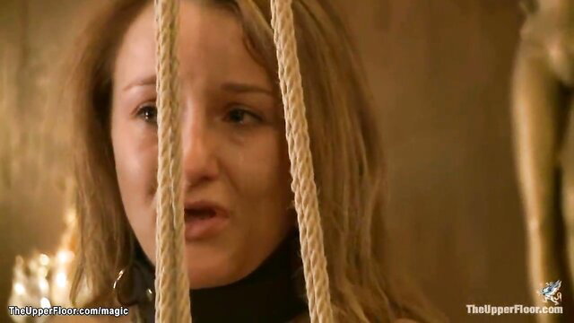 Kait Snow bound in ropes, mouth open in BDSM submission