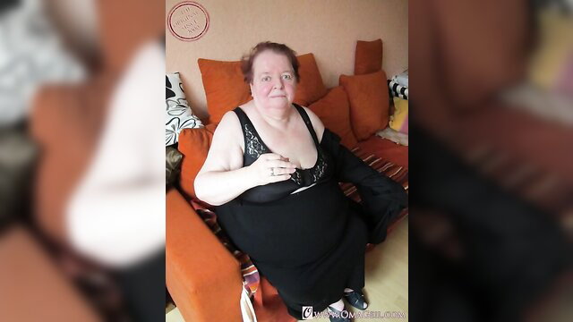 Amateur redhead BBW MILF in black lace bra and dress on couch