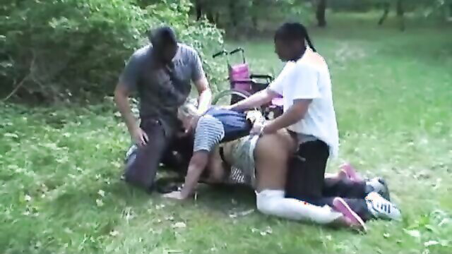 Chubby black MILF with huge tits gangbanged outdoors by two men