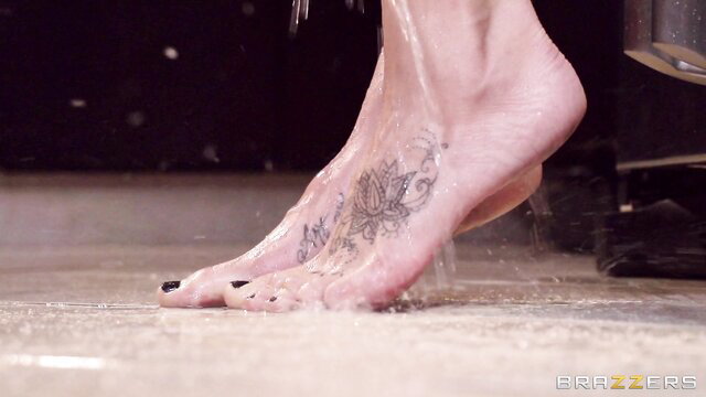 Sandee Westgate's tattooed feet dripping cum closeup