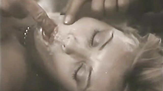 Retro blonde model giving blowjob in closeup, cum on face