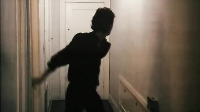 Silhouette of man dancing in hallway in Kinky Business stepmom pool party scene