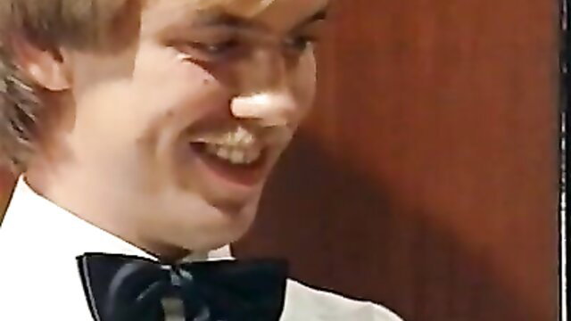 Young man in tux smiling with white powder on nose, classic kinky XXX thumbnail
