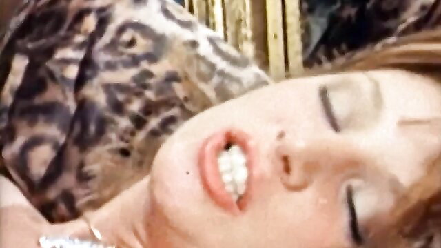 Closeup of retro pornstar with leopard dress getting facial cumshot