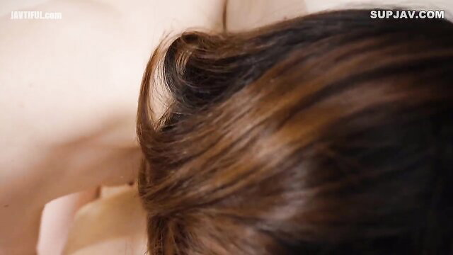 Closeup of plump chubby woman's brunette hair and neck in JAV scene