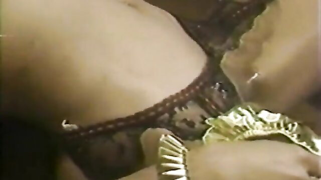 Ebony babe in black lace lingerie with ruffles, closeup hips and thighs