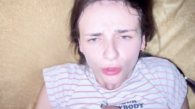 Petite Russian teen with tired eyes in striped tank top closeup