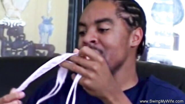 Black man with braids sucking wife's panties while cuckold watches