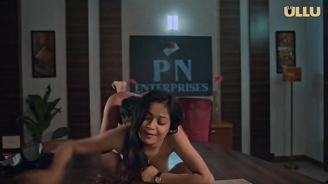 Big-titted Indian MILF nude on desk in steamy office sex