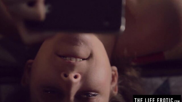 Emily J smiling upside down watching porn on phone, hot solo tease