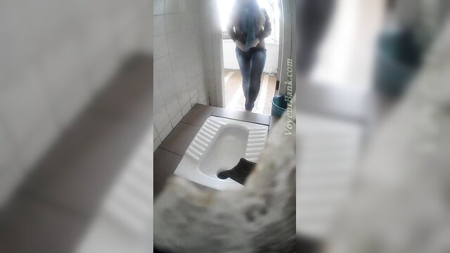 Blonde babe pees in toilet as tight jeans pulled down by Voyeur Bank