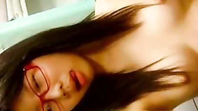 Hot Chinese slut in red glasses topless, naughty amateur closeup