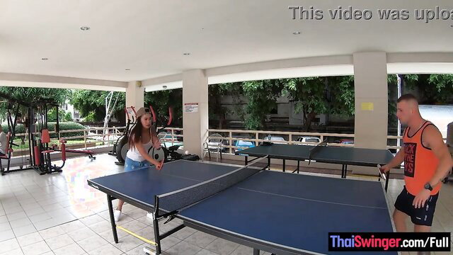 Curvy Thai amateur GF in white shorts playing ping pong outdoors