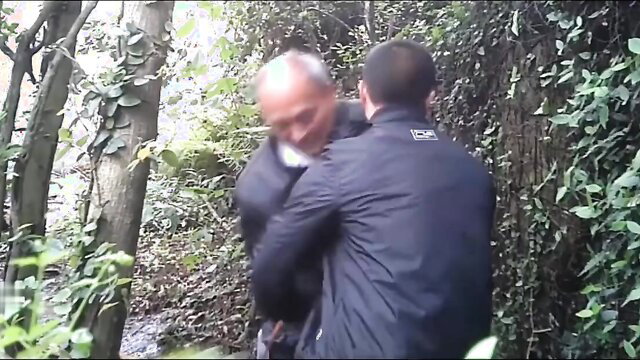 Asian men cruising in woods, one grabs another from behind for HJ action