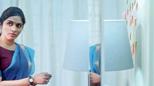 Beautiful Indian woman in sheer blue saree blouse showing cleavage