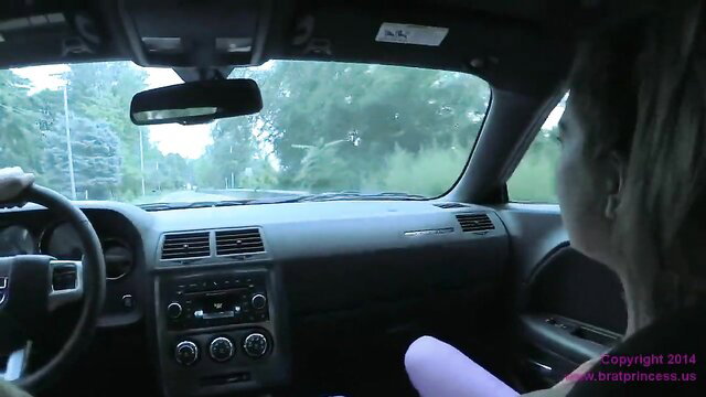 Blonde femdom driver in car, feet out, POV foot worship tease